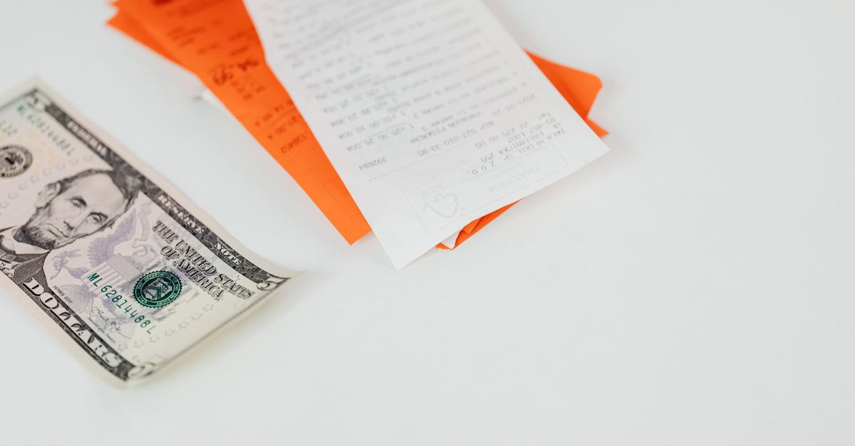 Illustration of two people reviewing a shared expense summary on a phone screen.